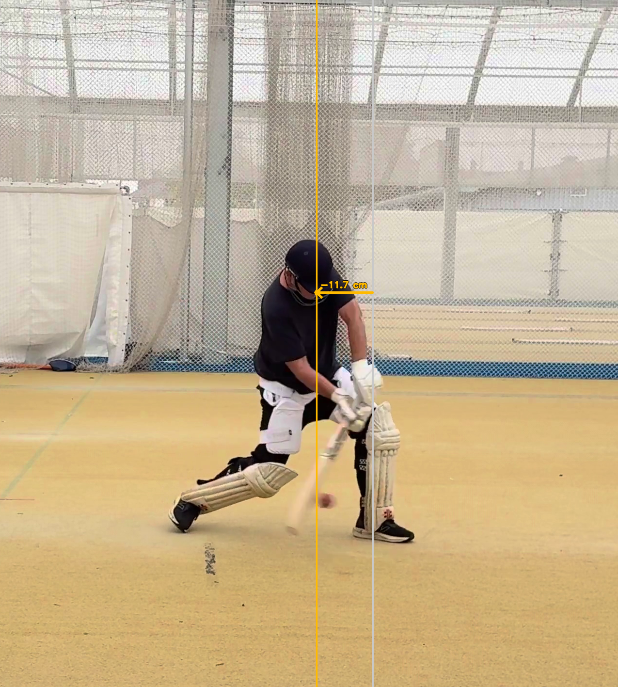 Head near front foot at impact